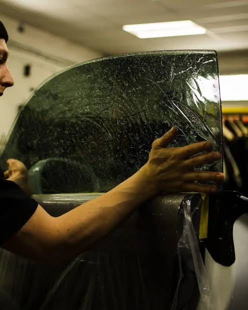 Window film being precisely installed on a vehicle